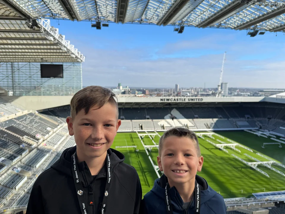 Two Boys at a Football Stadium